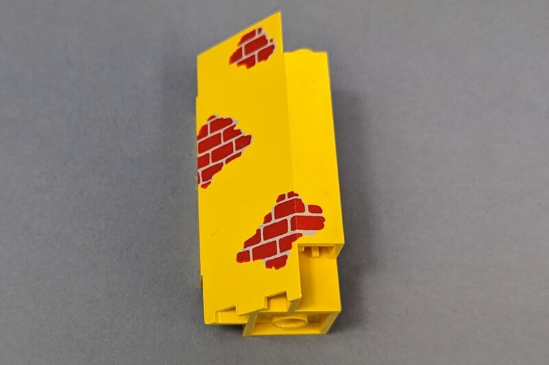 Lego Eck Panel in der Farbe Gelb mit Druck.