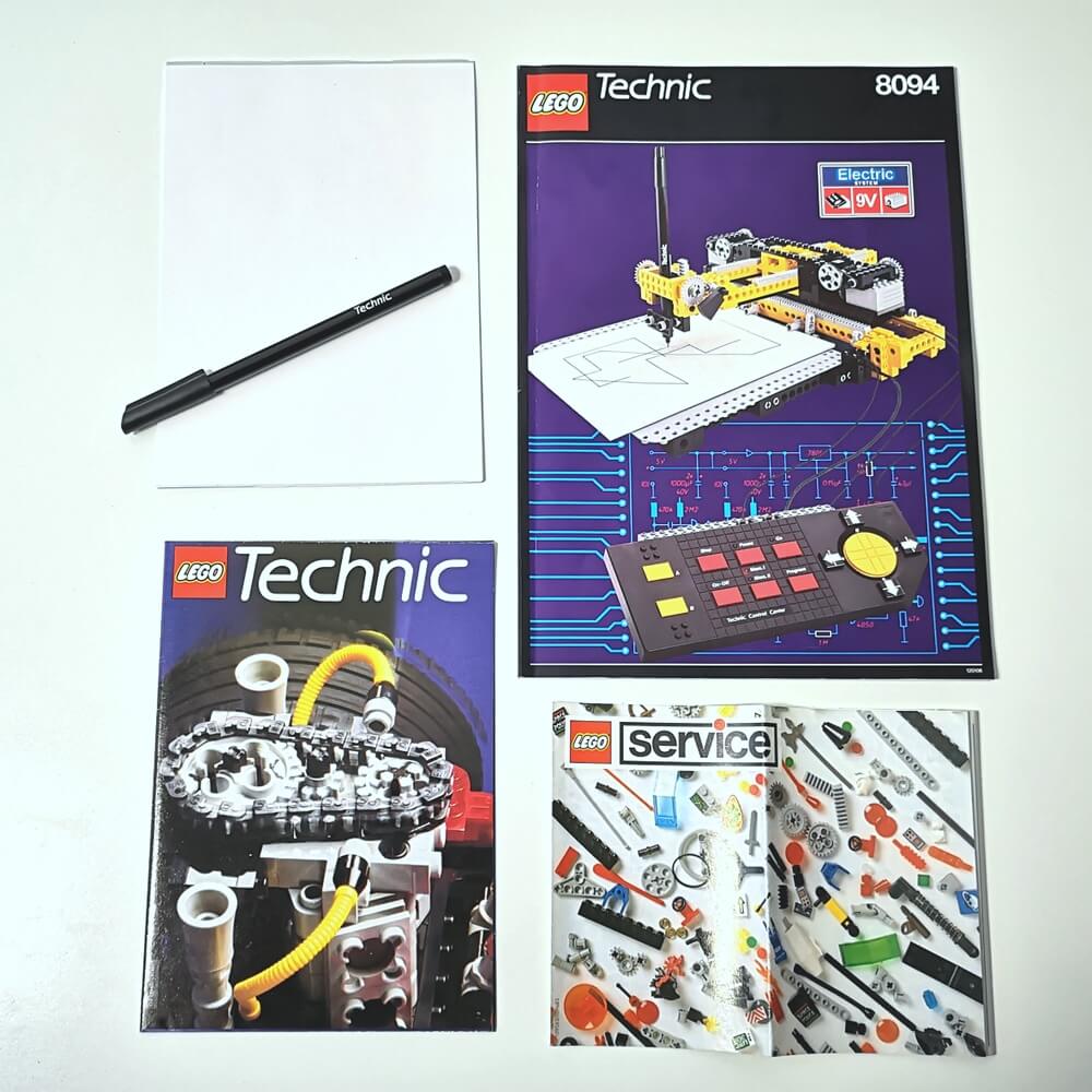 Der sehr seltene Lego-Stift mit Technic-Zeichenblock und Anleitungen.