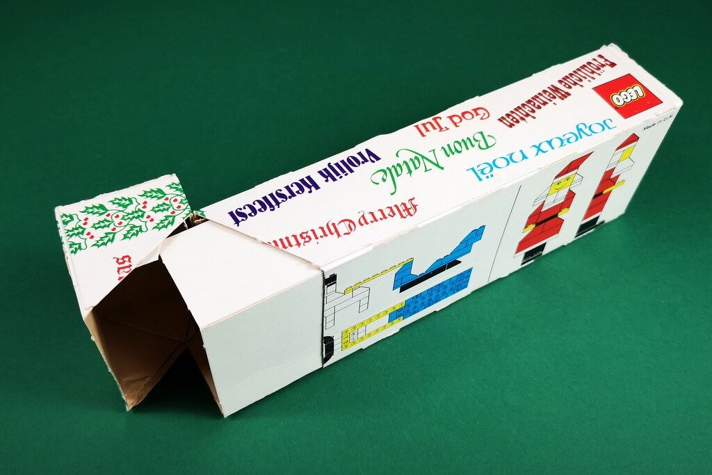In den 70er-Jahren wurden LEGO-Boxen wie eine Zigarettenschachtel geöffnet. Auf dem Bild ist die Box von Set 246 zu sehen, die geöffnet auf dem Tisch liegt.